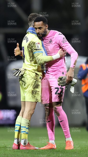 040325 - Preston North End v Swansea City - Sky Bet Championship - Lawrence Vigouroux of Swansea hugs Goalkeeper Freddie Woodman of Preston North End at the end of the match