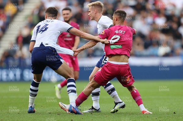 260823 - Preston North End v Swansea City - Sky Bet Championship - Jerry Yates of Swansea and Jordan Storey of Preston North End grab each others shirts