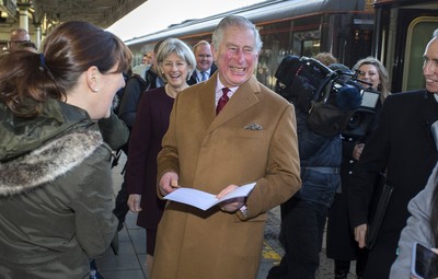 071218 - Picture shows HRH Prince Charles arriving in Cardiff at Central Station - Charles greets local children