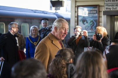 071218 - Picture shows HRH Prince Charles arriving in Cardiff at Central Station - Charles greets local children