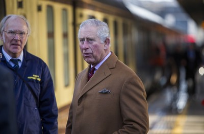 071218 - Picture shows HRH Prince Charles on the steam train after arriving in Cardiff at Central Station - Charles meets the engine crew