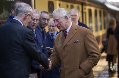 071218 - Picture shows HRH Prince Charles on the steam train after arriving in Cardiff at Central Station - Charles meets the engine crew