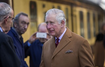 071218 - Picture shows HRH Prince Charles on the steam train after arriving in Cardiff at Central Station - Charles meets the engine crew