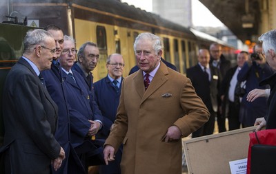 071218 - Picture shows HRH Prince Charles on the steam train after arriving in Cardiff at Central Station - Charles meets the engine crew