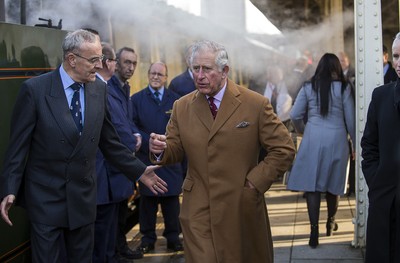 071218 - Picture shows HRH Prince Charles on the steam train after arriving in Cardiff at Central Station - Charles meets the engine crew