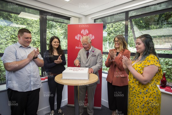 010719 - The Prince's Trust - Picture shows HRH Prince Charles visiting Connect Assist in Nantgarw, South Wales - The Prince of Wales cuts the cake