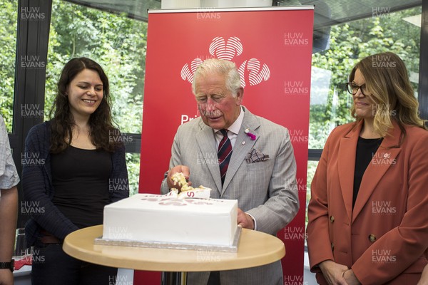010719 - The Prince's Trust - Picture shows HRH Prince Charles visiting Connect Assist in Nantgarw, South Wales - The Prince of Wales cuts the cake