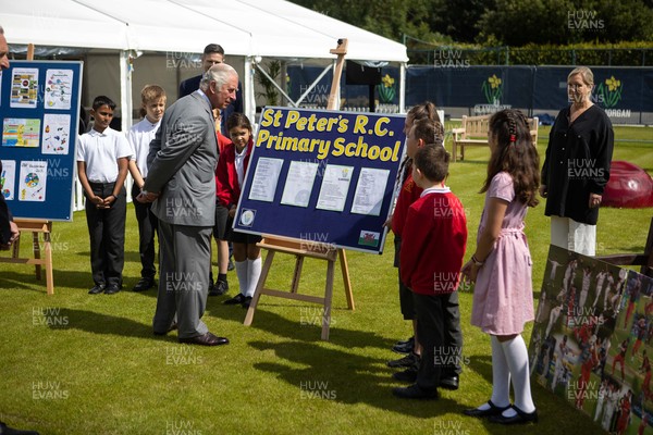 090721 - Prince Charles, the Prince of Wales meets school children from St Peters Primary during his visit to  Glamorgan County Crickets ground Sophia Gardens in Cardiff this morning