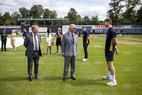 090721 - Prince Charles, the Prince of Wales meets Glamorgan player Joe Cooke during his visit to  Glamorgan County Crickets ground Sophia Gardens in Cardiff this morning