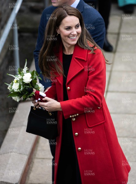 270922 - Picture shows their Royal Highness, Catherine,  Princess of Wales at St Thomas� Church in Swansea, their first official visit to the country with the title of Prince of Wales, receiving flowers from 2 year old Charlotte Buntun