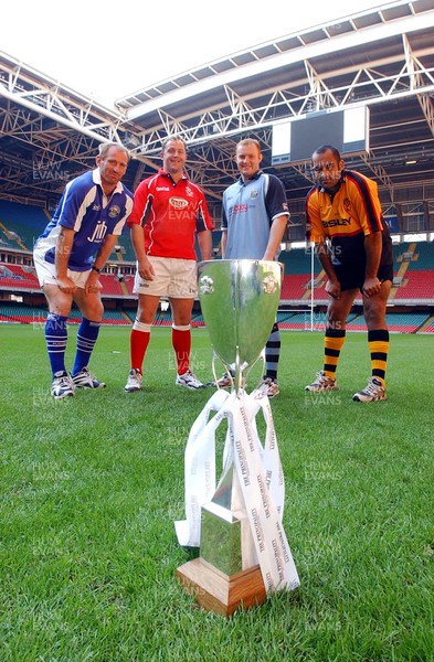 080403 - Principality Cup Semi Finals - (L-R) Bridgend's Gareth Thomas, Llanelli's Leigh Davies, Cardiff's Martyn Williams and Newport's Simon Raiwalui pictured at the Millennium Stadium with the Principality Cup trophy where Bridgend v Newport and Cardiff v Llanelli will decide the competition's finalists