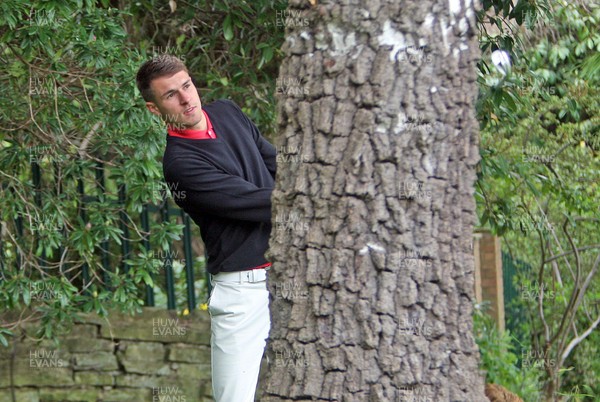 220513 - BMW PGA Golf ChampionshipPro-Celebrity Event - Arsenal and Wales footballer Aaron Ramsey in trouble behind a tree