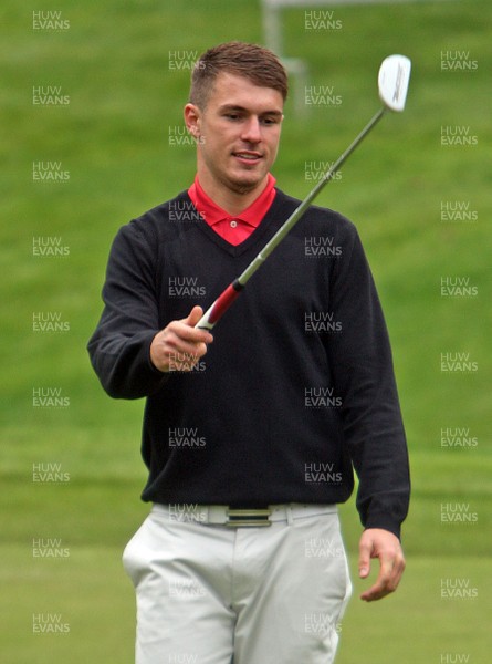 220513 - BMW PGA Golf ChampionshipPro-Celebrity Event - Aaron Ramsey of Arsenal rolls in a putt