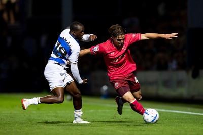 020926 - Queens Park Rangers v Cardiff City - Sky Bet Championship - Cian Ashford of Cardiff City is challenged by Glen Kamara of Queens Park Rangers