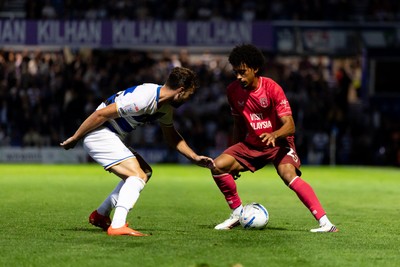 020926 - Queens Park Rangers v Cardiff City - Sky Bet Championship - Calum Scanlon of Cardiff City is challenged by Harvey Vale of Queens Park Rangers