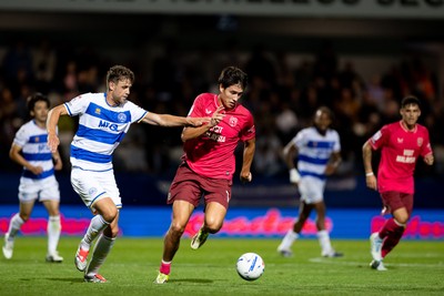 020926 - Queens Park Rangers v Cardiff City - Sky Bet Championship - Rubin Colwill of Cardiff City is challenged by Nicolas Madsen of Queens Park Rangers 