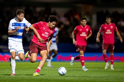 020926 - Queens Park Rangers v Cardiff City - Sky Bet Championship - Rubin Colwill of Cardiff City is challenged by Nicolas Madsen of Queens Park Rangers 
