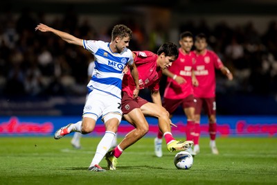 020926 - Queens Park Rangers v Cardiff City - Sky Bet Championship - Rubin Colwill of Cardiff City is challenged by Nicolas Madsen of Queens Park Rangers 