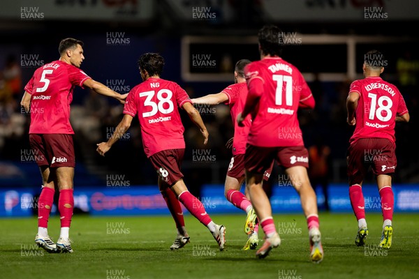 020926 - Queens Park Rangers v Cardiff City - Sky Bet Championship - Perry Ng of Cardiff City celebrates with his teammates after scoring their sides first goal