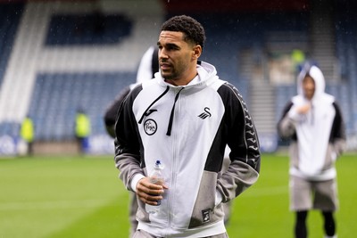 241026 - Queens Park Rangers v Swansea City - Sky Bet Championship - Ben Cabango of Swansea City walks on the pitch prior to the game