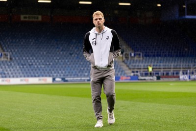 241026 - Queens Park Rangers v Swansea City - Sky Bet Championship - Stephen Welsh of Swansea City walks on the pitch prior to the game