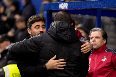241026 - Queens Park Rangers v Swansea City - Sky Bet Championship - V�tor Matos, Manager of Swansea City, hugs Julien St�phan manager of Queens Park Rangers