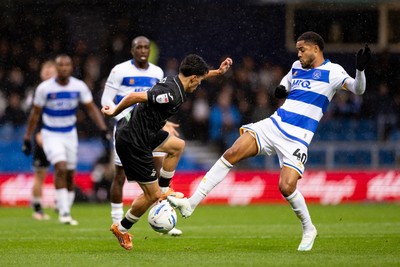 241026 - Queens Park Rangers v Swansea City - Sky Bet Championship - Elijah Just of Swansea City is challenged by Jonathan Varane of Queens Park Rangers