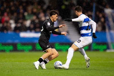 241026 - Queens Park Rangers v Swansea City - Sky Bet Championship - Filip Lissah of Swansea City is challenged by Harvey Vale of Queens Park Rangers