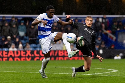 241026 - Queens Park Rangers v Swansea City - Sky Bet Championship - Kwame Poku of Queens Park Rangers and Jay Fulton of Swansea City battle for the ball