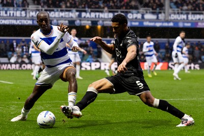 241026 - Queens Park Rangers v Swansea City - Sky Bet Championship - Glen Kamara of Queens Park Rangers and Ben Cabango of Swansea City battle for the ball