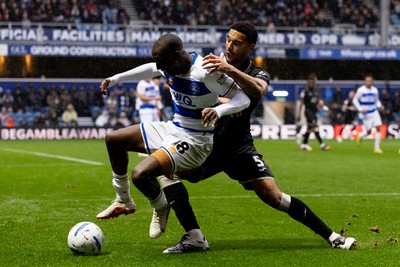 241026 - Queens Park Rangers v Swansea City - Sky Bet Championship - Glen Kamara of Queens Park Rangers and Ben Cabango of Swansea City battle for the ball