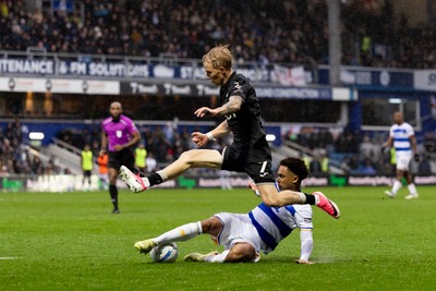 241026 - Queens Park Rangers v Swansea City - Sky Bet Championship - Melker Widell of Swansea City is challenged by Kealey Adamson of Queens Park Rangers