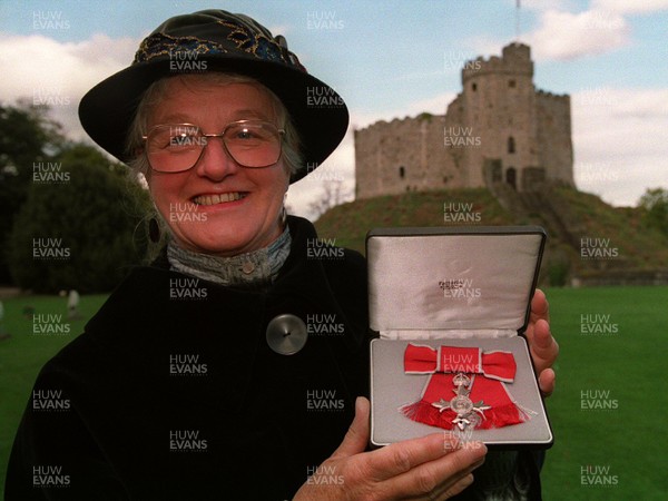 151093 - Miss Audrey Walker (65) from Pembrokeshire with her MBE for services to Embroidery