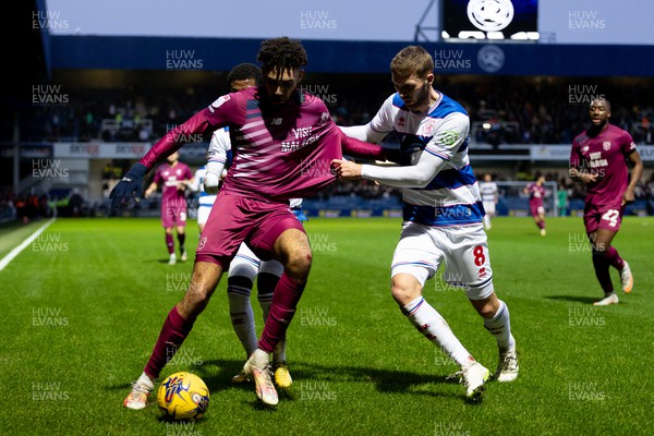 010124 - Queens Park Rangers v Cardiff City - Sky Bet Championship - Kion Etete of Cardiff City is challenged by Sam Field of Queens Park Rangers 