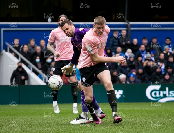 050322 - Queens Park Rangers v Cardiff City - Sky Bet Championship - Mark McGuinness of Cardiff City and  David Marshall of Queens Park Rangers battle for the ball