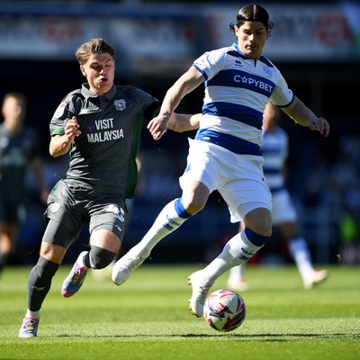 050425 - Queens Park Rangers v Cardiff City - Sky Bet Championship - Cian Ashford of Cardiff City is challenged by Ronnie Edwards of Queens Park Rangers