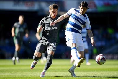 050425 - Queens Park Rangers v Cardiff City - Sky Bet Championship - Cian Ashford of Cardiff City is challenged by Ronnie Edwards of Queens Park Rangers
