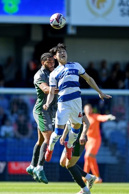 050425 - Queens Park Rangers v Cardiff City - Sky Bet Championship - Andy Rinomhota of Cardiff City is challenged by Yang Min-Hyeok of Queens Park Rangers