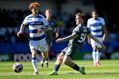 050425 - Queens Park Rangers v Cardiff City - Sky Bet Championship - Isaak Davies of Cardiff City is challenged by Jack Colback of Queens Park Rangers