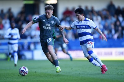 050425 - Queens Park Rangers v Cardiff City - Sky Bet Championship - Isaak Davies of Cardiff City is challenged by Yang Min-Hyeok of Queens Park Rangers