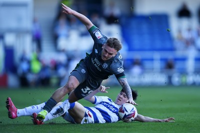 050425 - Queens Park Rangers v Cardiff City - Sky Bet Championship - Isaak Davies of Cardiff City is challenged by Yang Min-Hyeok of Queens Park Rangers
