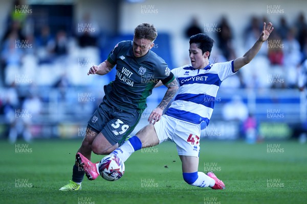 050425 - Queens Park Rangers v Cardiff City - Sky Bet Championship - Isaak Davies of Cardiff City is challenged by Yang Min-Hyeok of Queens Park Rangers