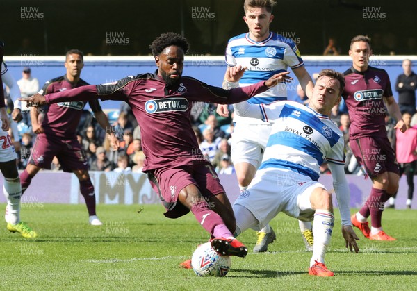 130419 - Queens Park Rangers v Swansea City, Sky Bet Championship - Nathan Dyer of Swansea City holds off the challenge from Josh Scowen of Queens Park Rangers