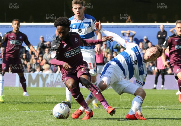 130419 - Queens Park Rangers v Swansea City, Sky Bet Championship - Nathan Dyer of Swansea City holds off the challenge from Josh Scowen of Queens Park Rangers