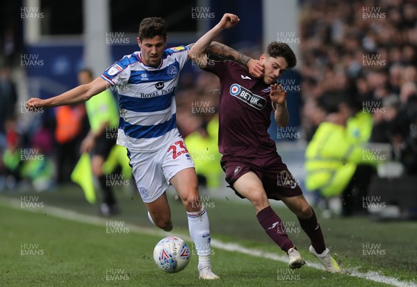 130419 - Queens Park Rangers v Swansea City, Sky Bet Championship - Daniel James of Swansea City is challenged by Pawel Wszolek of Queens Park Rangers as he looks to win the ball