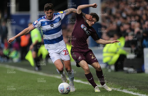 130419 - Queens Park Rangers v Swansea City, Sky Bet Championship - Daniel James of Swansea City is challenged by Pawel Wszolek of Queens Park Rangers as he looks to win the ball