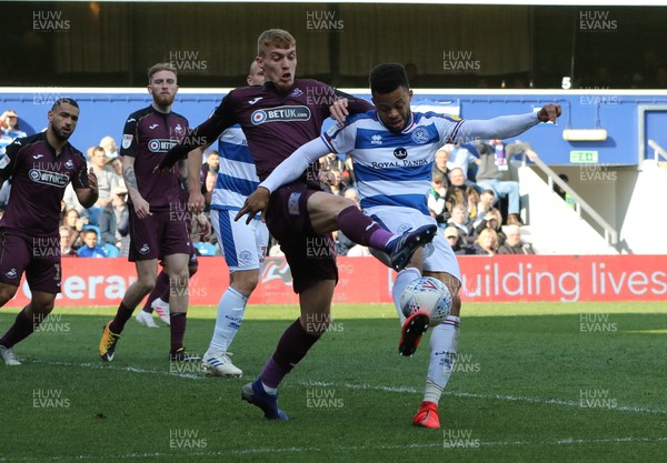 130419 - Queens Park Rangers v Swansea City, Sky Bet Championship - Jay Fulton of Swansea City and Jordan Cousins of Queens Park Rangers compete for the ball