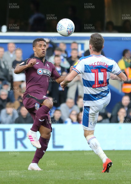 130419 - Queens Park Rangers v Swansea City, Sky Bet Championship - Wayne Routledge of Swansea City and Josh Scowen of Queens Park Rangers compete for the ball