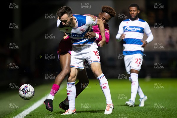 190923 - Queens Park Rangers v Swansea City - Sky Bet Championship - Olivier Ntcham of Swansea City and Morgan Fox of Queens Park Rangers battle for the ball
