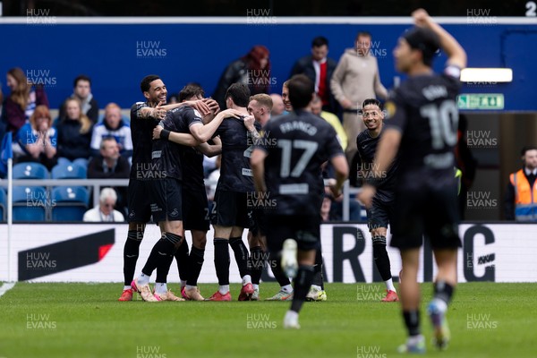 210425 - Queens Park Rangers v Swansea City - Sky Bet Championship - Harry Darling of Swansea City celebrates with his teammates after scoring his sides second goal